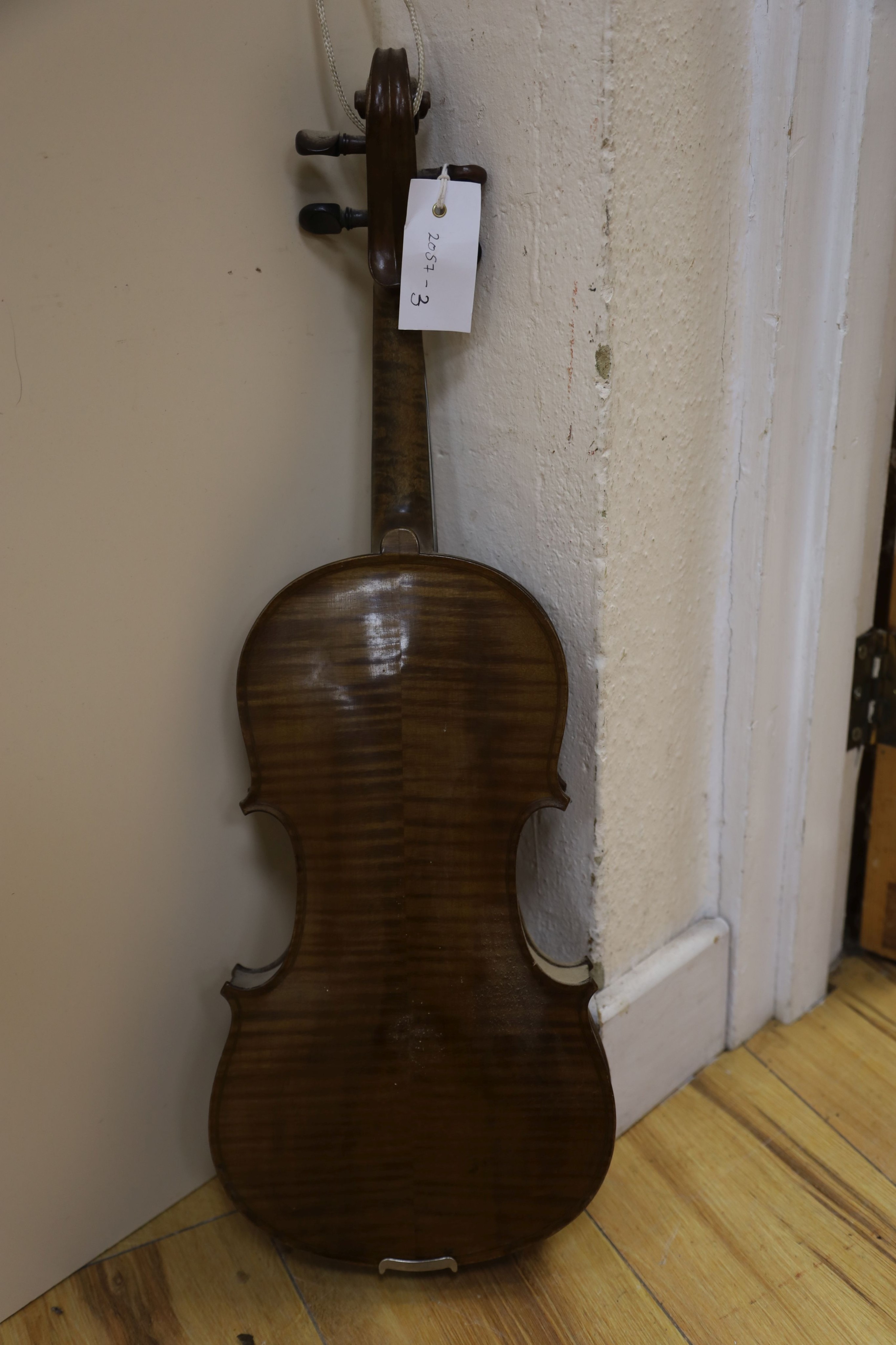 A violin labelled Francesco Ruggeri and a bow. Back of violin excluding button - 36cm